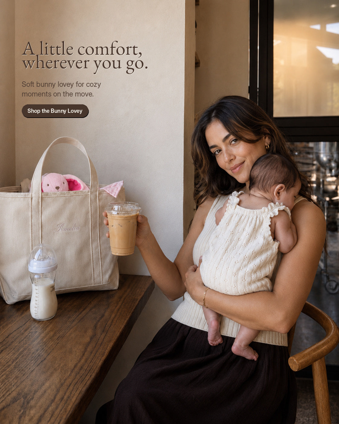 A caregiver holding a child beside a bag containing the pink bunny lovey.